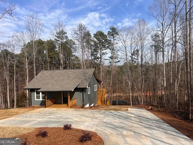Located on a .46-acre lakefront lot in Martin, GA, 410 Lakeside - photo 3