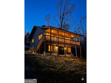 Located on a .46-acre lakefront lot in Martin, GA, 410 Lakeside - photo 4