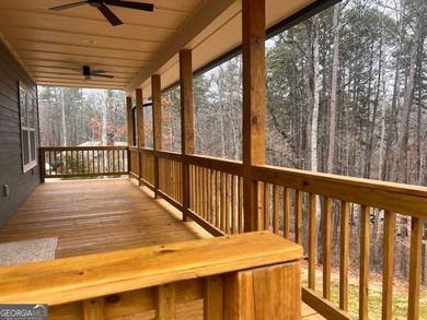 Located on a .46-acre lakefront lot in Martin, GA, 410 Lakeside - photo 6