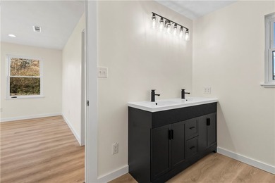 Step into this fully renovated 3-bedroom, 2-bath home located - photo 19
