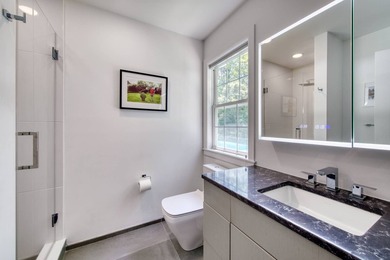 Set on 1.4 exquisitely landscaped acres in coveted East Hampton - photo 13