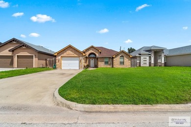 Welcome to this beautifully maintained 4-bedroom, 2-bathroom