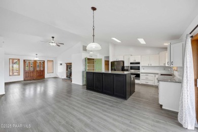 This spacious four-bedroom, four-bath home blends comfort with