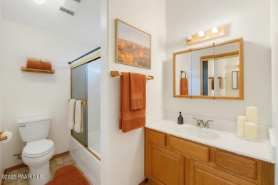 This spacious four-bedroom, four-bath home blends comfort with