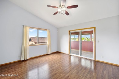 This spacious four-bedroom, four-bath home blends comfort with