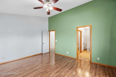 This spacious four-bedroom, four-bath home blends comfort with