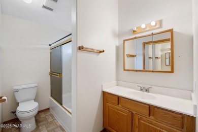 This spacious four-bedroom, four-bath home blends comfort with