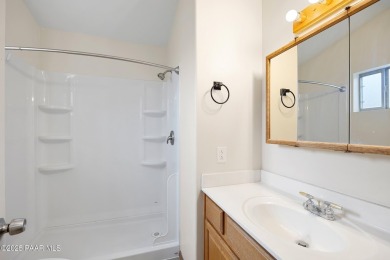 This spacious four-bedroom, four-bath home blends comfort with