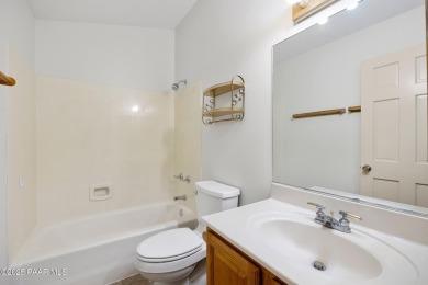 This spacious four-bedroom, four-bath home blends comfort with