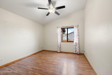 This spacious four-bedroom, four-bath home blends comfort with