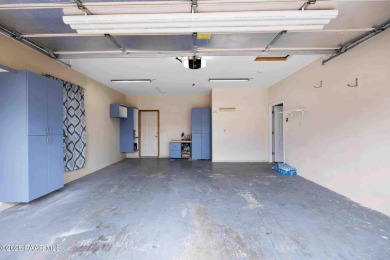 This spacious four-bedroom, four-bath home blends comfort with