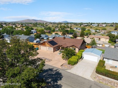 This spacious four-bedroom, four-bath home blends comfort with