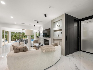 LUXURY updated 4 bedroom/3 bathroom SMART home in Coral Ridge - photo 12