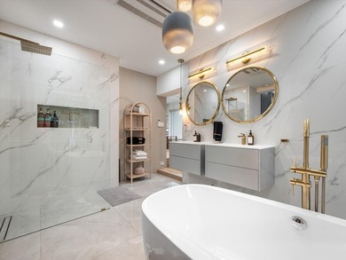 LUXURY updated 4 bedroom/3 bathroom SMART home in Coral Ridge - photo 19