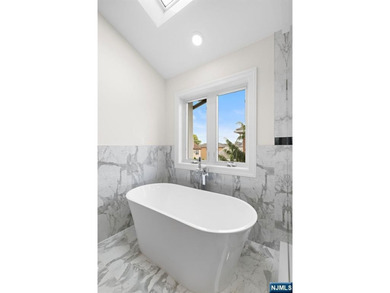 Stunning modern new construction new foundation unit in the - photo 20