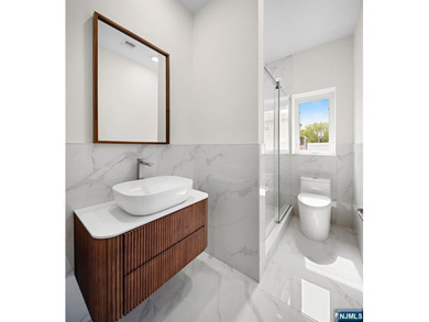 Stunning modern new construction new foundation unit in the - photo 24