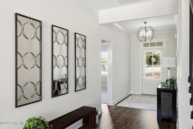 Nestled within the gated community of Seven Lakes West, this - photo 3