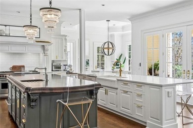 This extraordinary estate in the prestigious Windward community