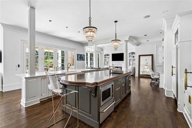 This extraordinary estate in the prestigious Windward community