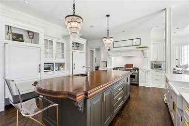 This extraordinary estate in the prestigious Windward community