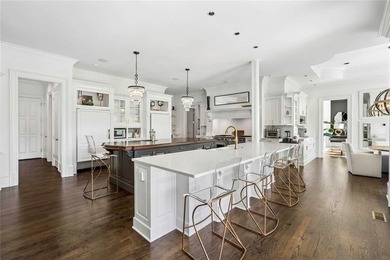 This extraordinary estate in the prestigious Windward community