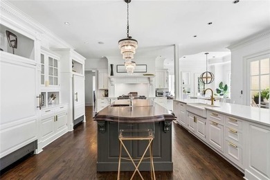 This extraordinary estate in the prestigious Windward community