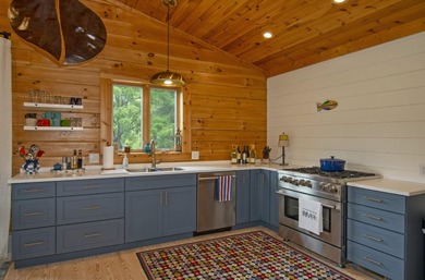 Welcome to this beautifully renovated log home tucked away in a - photo 22