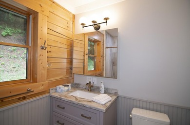 Welcome to this beautifully renovated log home tucked away in a - photo 35