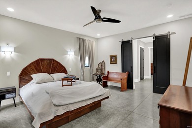 This exceptional 2-year-old barndominium offers modern country