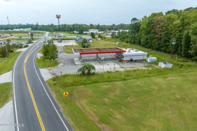 Prime location! Building in place with a new roof with gas tanks