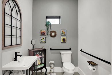 This exceptional 2-year-old barndominium offers modern country