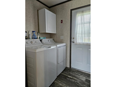 Tucked away at the end of the street in a mobile home park, this - photo 17