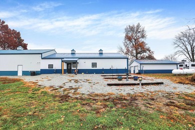 This exceptional 2-year-old barndominium offers modern country