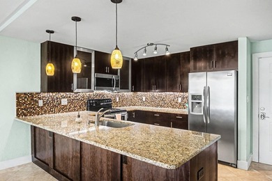 Wake up to shimmering harbor views and effortless coastal - photo 15