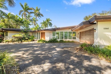 Nestled within the prestigious gated community of Gables by the - photo 1