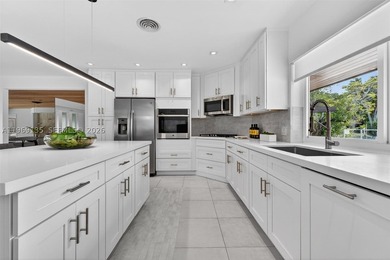 Nestled within the prestigious gated community of Gables by the - photo 10