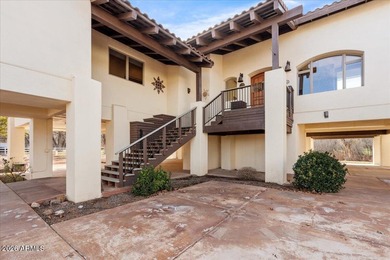 Tucked behind a gated entrance and accessed by a private drive