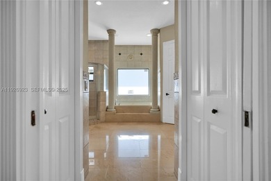 This stunning property features high-polished marble floors - photo 32