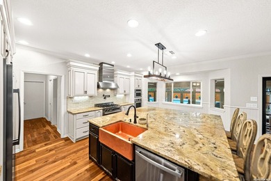 Set on a full acre in the exclusive gated community of Raintree - photo 5