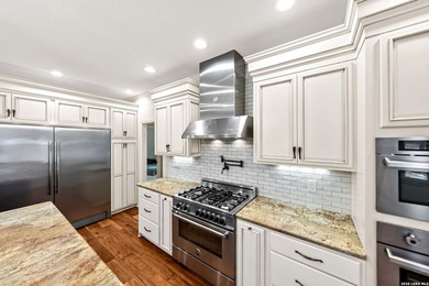 Set on a full acre in the exclusive gated community of Raintree - photo 6