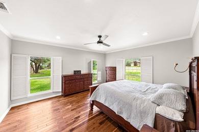 Set on a full acre in the exclusive gated community of Raintree - photo 7