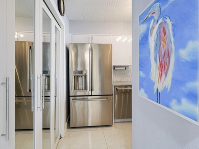 Beautifully renovated with stunning white tile, freshly painted - photo 13