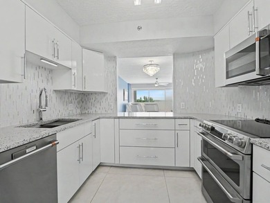 Beautifully renovated with stunning white tile, freshly painted - photo 14