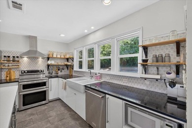 Nestled on a spacious double lot of just over half an acre, this - photo 17