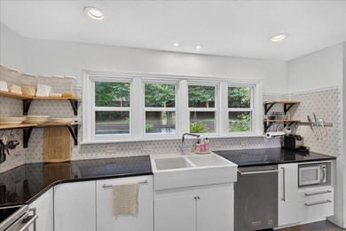 Nestled on a spacious double lot of just over half an acre, this - photo 18