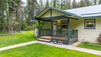 Nestled among the Larch and Douglas Fir Trees sits this charming - photo 2