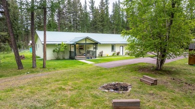 Nestled among the Larch and Douglas Fir Trees sits this charming - photo 6