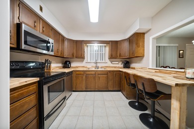 This spacious ground level condo has NO STAIRS.  New flooring in