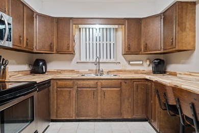 This spacious ground level condo has NO STAIRS.  New flooring in