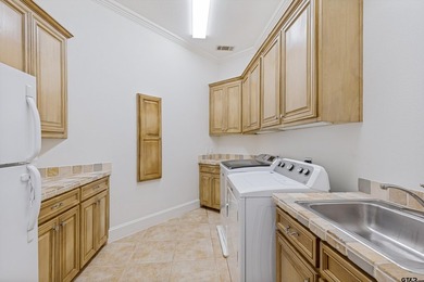 Situated in the prestigious gated community of The Lakes on - photo 34